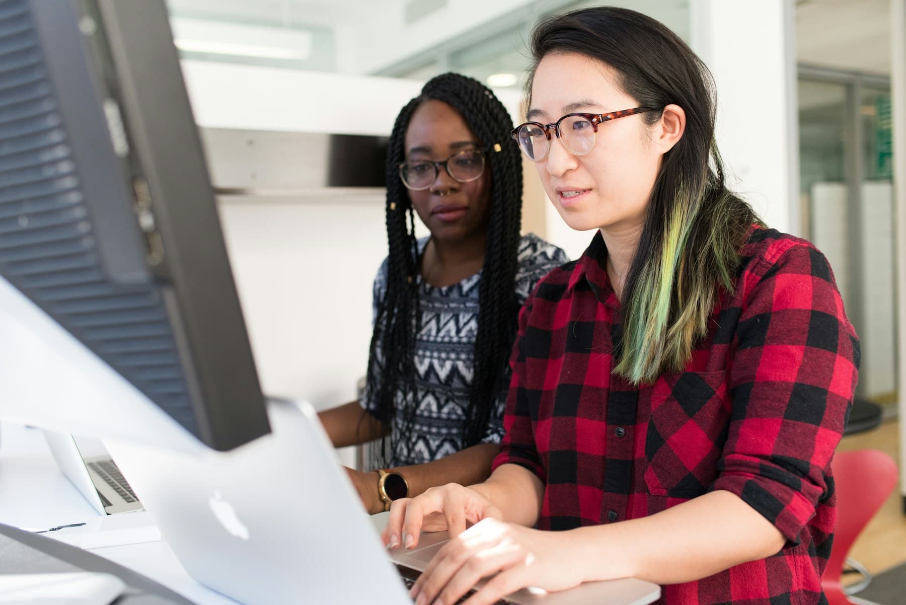 Software engineers working through a technical problem